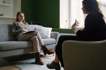 Female psychologist listening to client