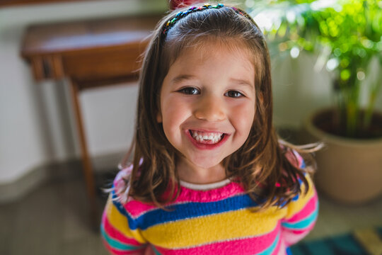 Little Girl Showing Missing Teeth