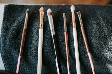 make up brushes on a black towel