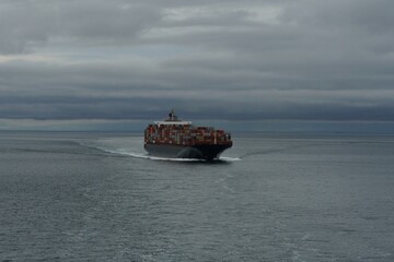 Picture with copy space of container vessel from other ship underway approaching the port of...