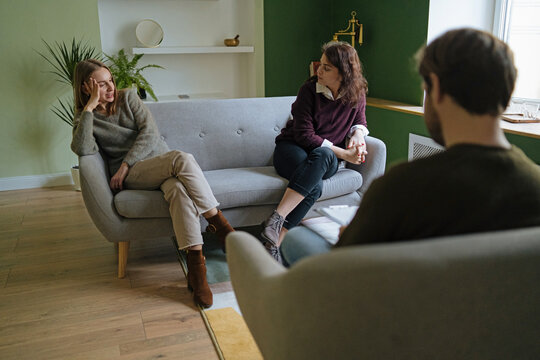 a couple of lesbians at the reception of a psychoanalyst