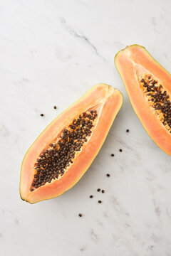 Cut half of rope fresh papaya fruit.