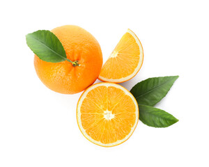 Cut and whole fresh ripe oranges with green leaves on white background, top view