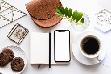 White home office tabletop with smartphone mock-up, coffee cup and notepad