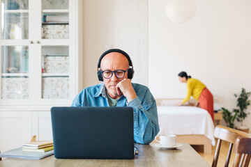 A Man Working on a Computer at Home