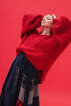 Female model in baggy clothes touching hair