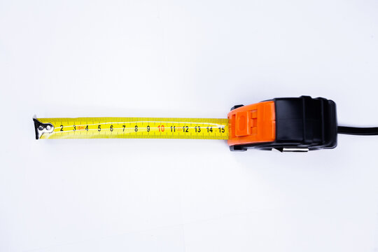 Yellow measuring tape isolated cut out on white background, top view