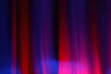 Dark blue and red abstract colorful lights background with space to write your text