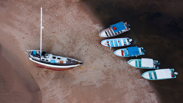 overhead view of a lonely yacht on the coast