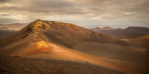 Sunset on Caldera Blanca, an extinct volcanic crater on Lanzarote island, Canary Islands. The crater is made up of solidified lava.