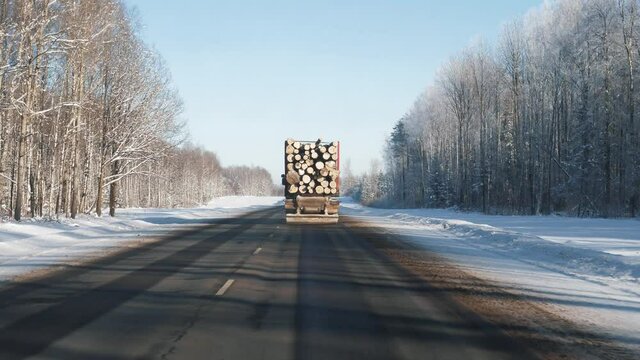 Truck Transportation Felled Tree Trunks Along The Highway