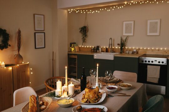 Room with festive table served for Christmas dinner