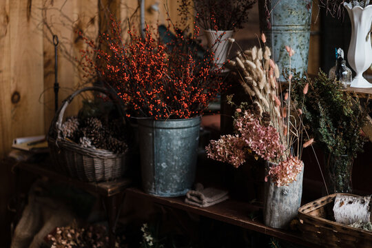 dried hydrangeas, grass and berries in florist