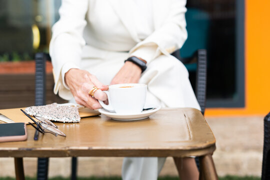 Senior woman drinking a coffee at coffee shop