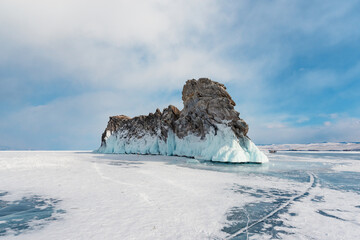 Ice-covered Ogoy Island in the Maloye More Bay of Lake Baikal in winter. Siberia, Russia