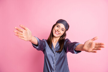 Photo portrait of pretty girl inviting to hug isolated on pastel pink colored background