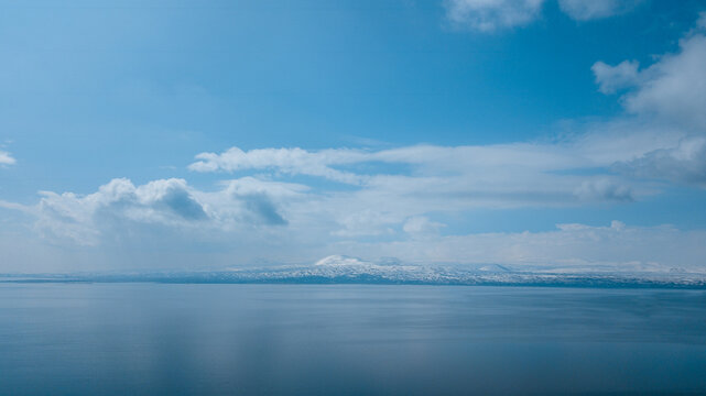 Sevan lake and a snowy mountain chain