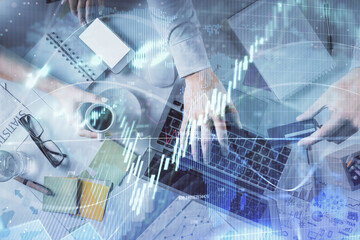 Double exposure of man and woman working together and forex graph hologram drawing. Financial analysis concept. Computer background. Top View.