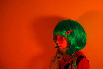 Portrait of a glamour little girl wearing colorful wig