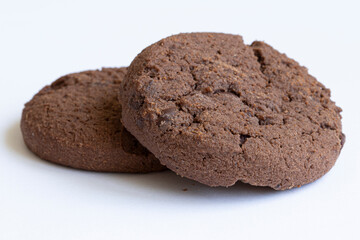 Delicious round chocolate chip cookies with chocolate pieces on a light background.