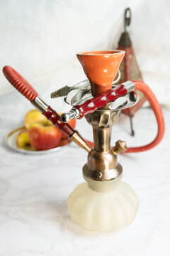 Glass arabian smoking hookah shisha  with apple flavor on a white background