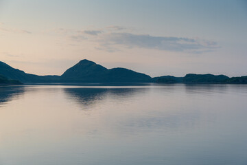 View of the coast and mountains of Geographic Harbor, Katmai, Alaska just after sunrise.