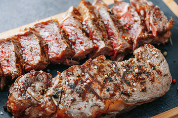 juicy fresh fried steaks for dinner. two fried striploin steak in a medium roasting rare