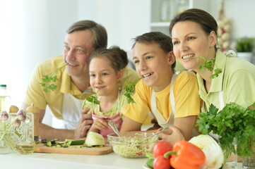 Cute family cooking together in kitchen