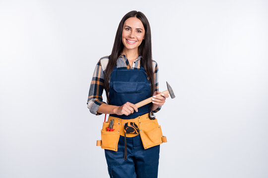 Photo of happy smiling good mood lovely repairman woman hold equipment hammer isolated on white color background