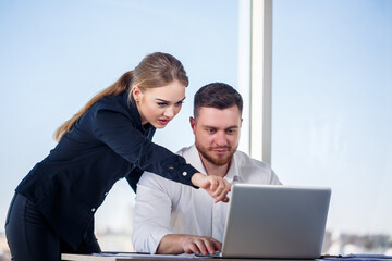 A female manager in her own office talks about a successful new business plan for economic...