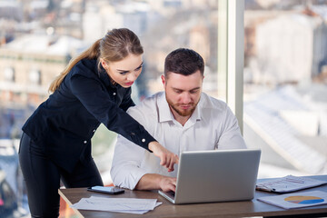 A female manager in her own office talks about a successful new business plan for economic...
