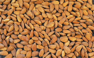 Organic almond nuts as background, top view. Healthy snack