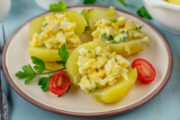 Boiled and fried potatoes stuffed with egg filling