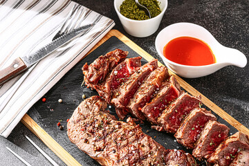 juicy fresh fried steaks for dinner. two fried striploin steak in a medium roasting rare