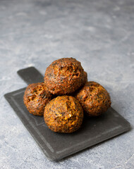 Fried falafel on a black slate board for snacks. Traditional oriental snack