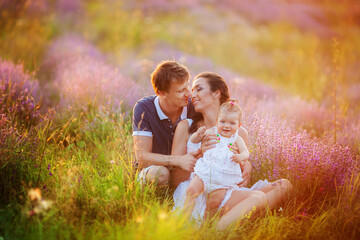 Fototapeta premium Happy young family with children having fun outdoors.