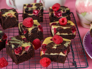Chocolate brownie with cream cheese and raspberries