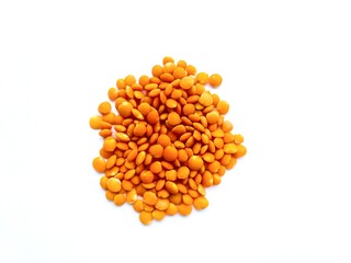 Red lentils isolated on white background.  A source of protein in vegetarian diets.