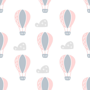 Vector scandinavian baby Seamless pattern of colorful air balloons and clouds isolated on white background. Simple kids illustration texture for nordic wallpaper, fills, web page background © timonko