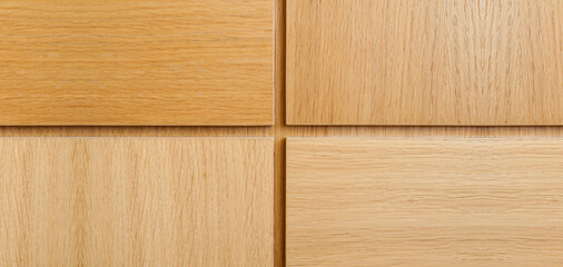 Wooden background. Squares and shapes on a wooden surface.