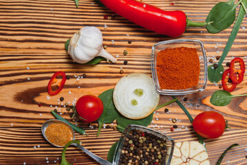 Spices and herbs over wooden background, healthy or cooking concept.
