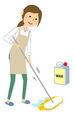 ワックスがけをするエプロンの女性