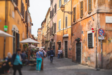 Fototapeta na wymiar Trastevere district, Rome, Italy, view of rione Trastevere, Roma, with historical narrow streets, Municipio I, west bank of Tiber in Rome, Lazio, Italy, cozy streets with restaurants and architecture