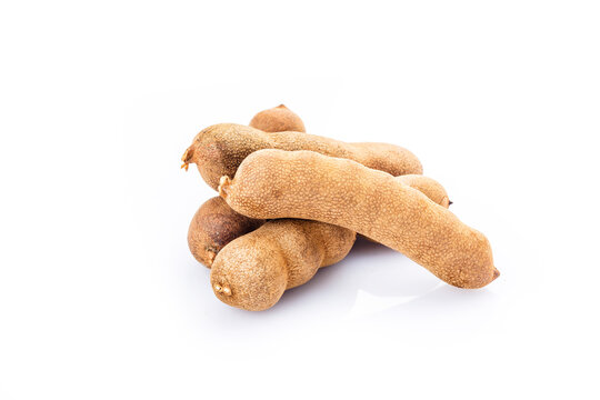 Tamarind (Tamarindus indica) fruit isolated on white background