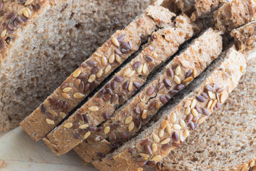 Bread with seeds on a wooden board