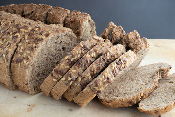 Bread with seeds on a wooden board