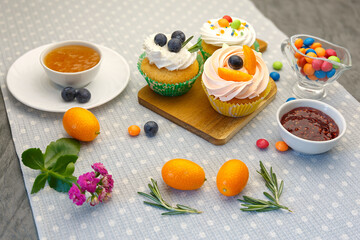 Easter holiday dessert table with cupcakes and sweets.
