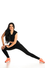 young and happy sporty woman doing stretching  exercises