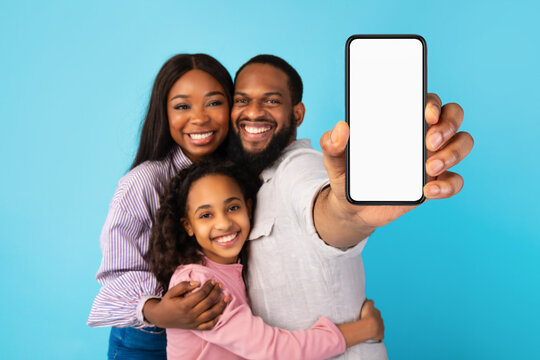 Black Family Showing Blank Empty Smartphone Screen For Mockup