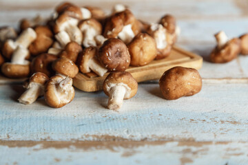 .Fresh shiitake mushrooms on the wooden kitchen table